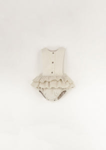 Off-white romper suit with bib and frill