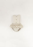 Off-white romper suit with bib and frill